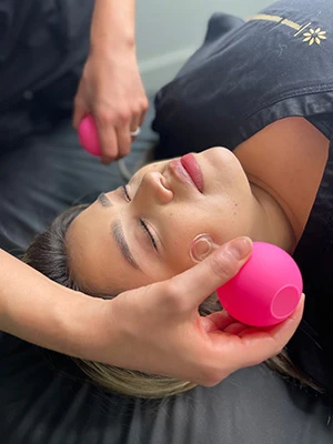 A patient receiving cosmetic treatment to their face