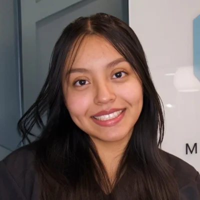 A headshot photo of Carmen, a patient accounts coordinator at Thrive Integrative Health