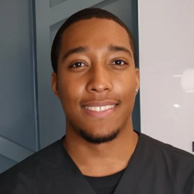 A headshot photo of Dion Blackmon, an acupuncturist at Thrive Integrative Health