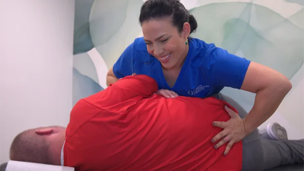 Dr. Christina Wellner adjusting a patient's back
