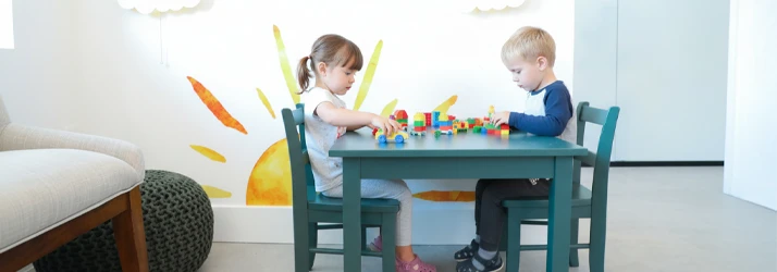Two children playing in the kids corner