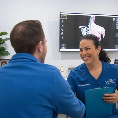 Dr. Christina Wellness shaking a patient's hand